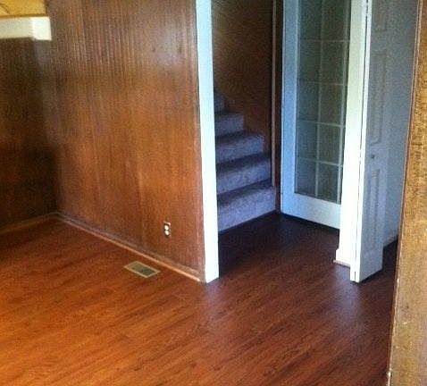 Stairs from kitchen leading to upstairs bedroom