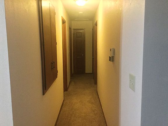 Hallway to bedrooms and full