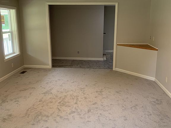 Great size living room with TV shelf or display shelf