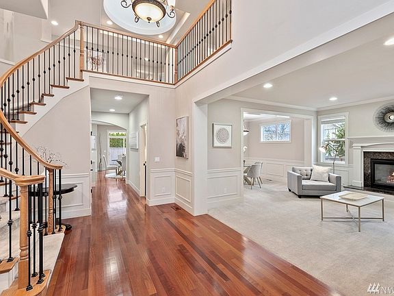 Gorgeous curved staircase leads to the upper level.