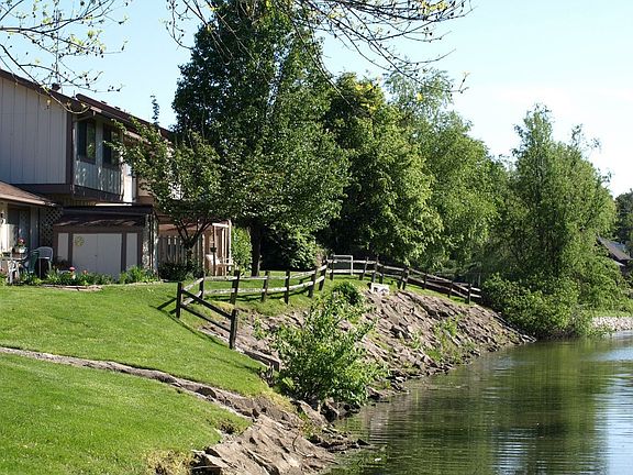 the lake behind the house that wraps around the complex