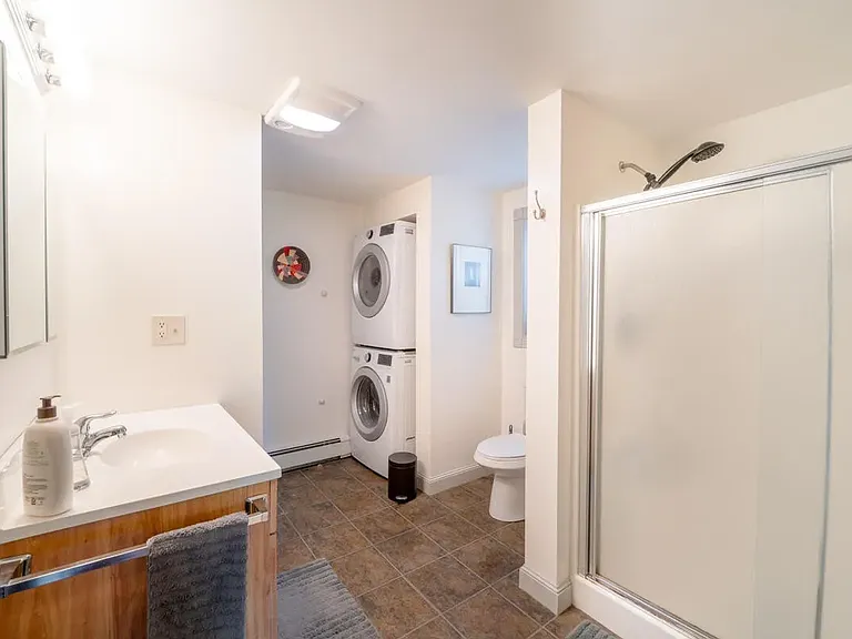 Master bathroom has washer/dryer, large linen closet and heated fan