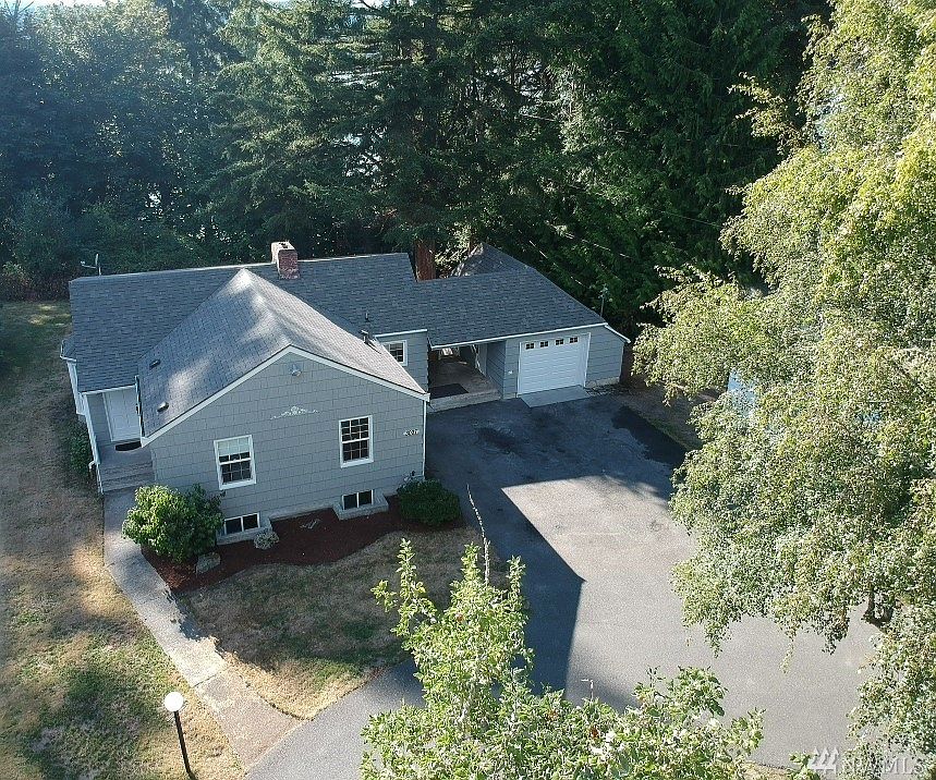 Large lot with circular driveway with plenty of parking for RV or boat. New roof and new garage door!