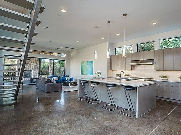 High ceilings, poilshed concrete floors, great lighting and pre-wired for surround throughout the first floor are just a few of the fine details in this home!