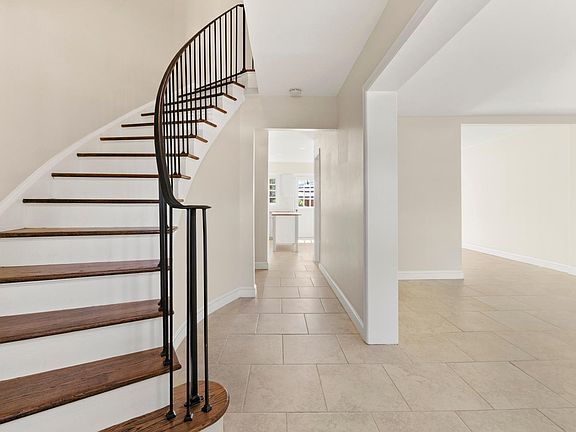 Grand, sweeping staircase as you enter home ...