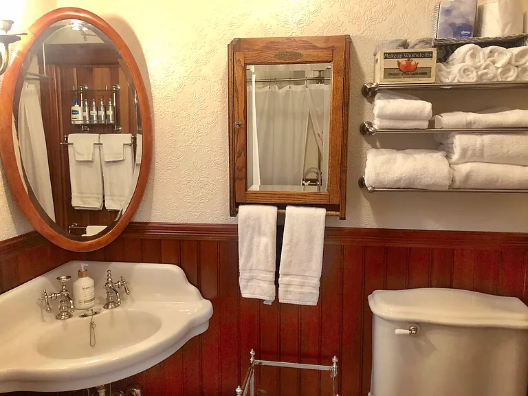 You'll love the convenient antique medicine cabinet to store your toiletries. Forgot something? Extra complimentary toiletries are also provided.