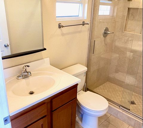 Deluxe bathroom with travertine shower