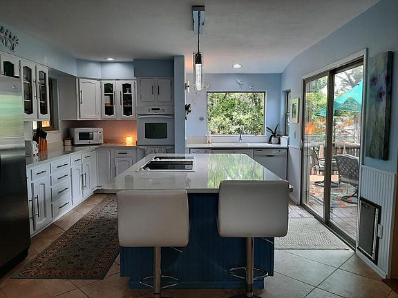 Kitchen looking on to portion of back deck