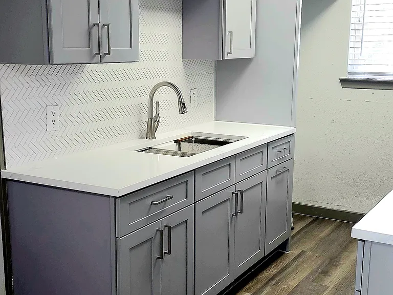 new cabinets, quartz, appliances stove and microwave