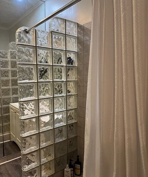 Step-in shower and indoor washer/dryer.