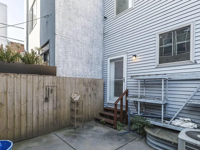 back patio with access to the community garden
