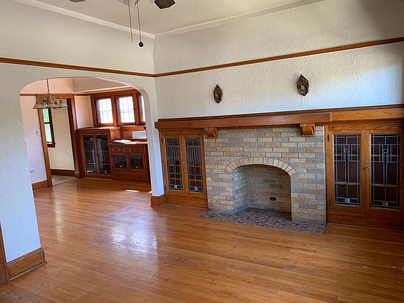 Living room and dining room with decorative Fireplace
