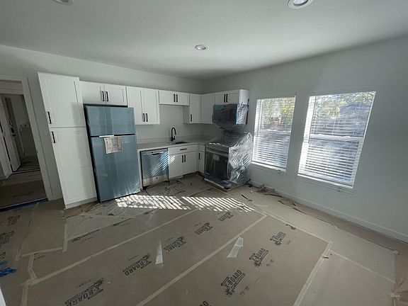 Brand new stainless steel appliances and cabinets.