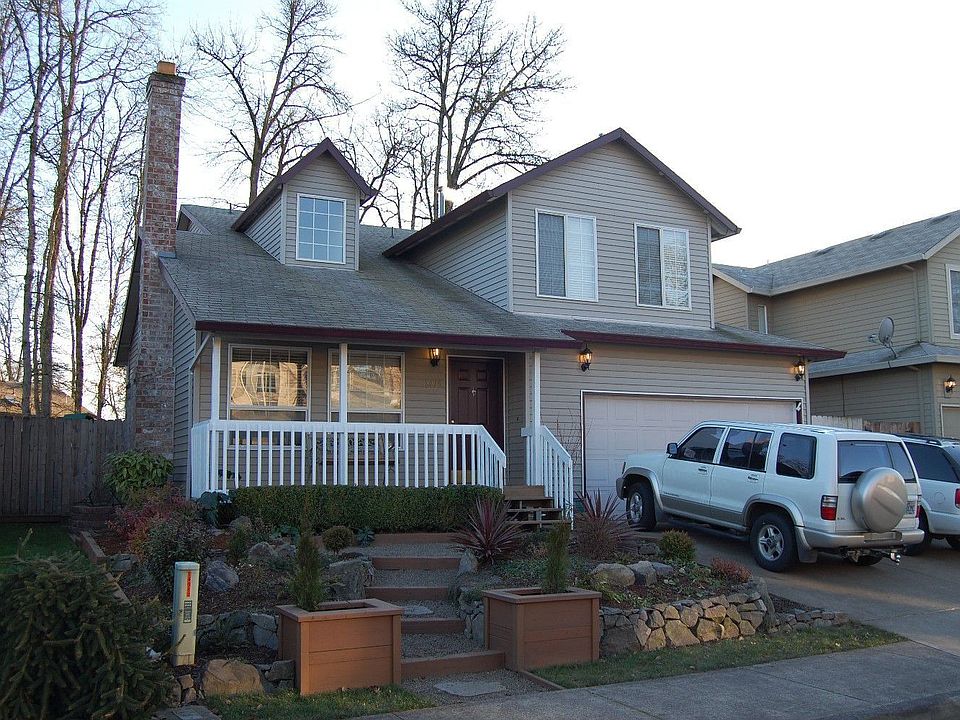 Custom landscaping in front w/ drip system