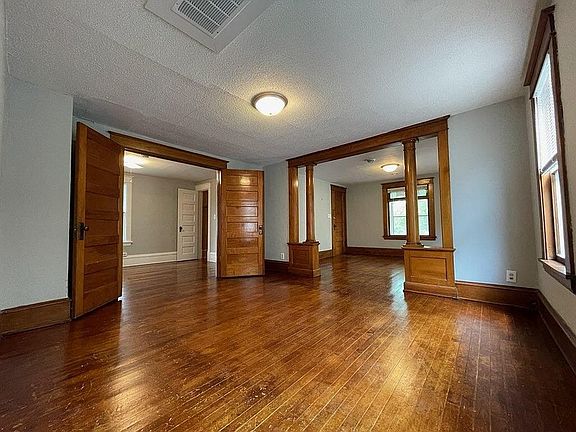 Dining room; bedroom doors (left), living room (right)