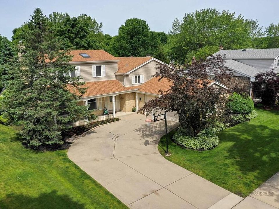 Brids-eye view. The the skylight above master bathroom and extra wide-driveway with attached 2-car garage