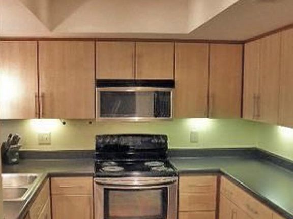 New oven with smooth cooktop being installed.
