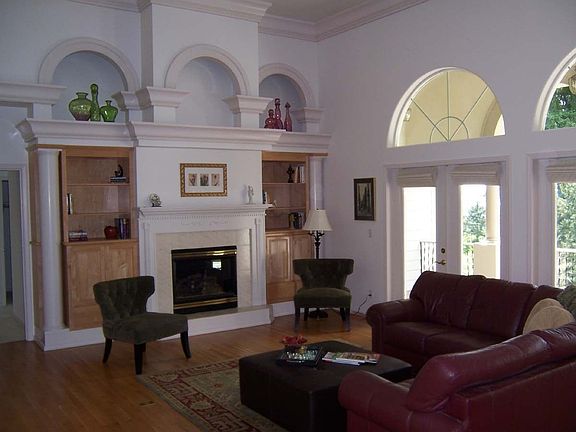 14 foot ceilings, covered verandas, extensive mouldings, hardwoods