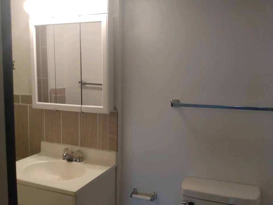 BATHROOM HAS VANITY, STOOL & SHOWER