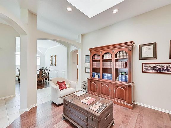 Sitting room featuring recessed lighting, arched walkways, and light wood-type flooring