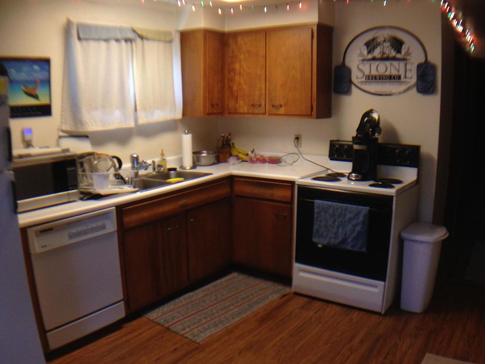 Kitchen with stove, frig, dishwasher.