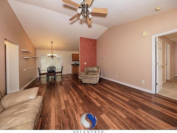 Spacious living room opens to dining area. Updated window treatments, upgraded Pella sliding glass door w/blinds between the gla