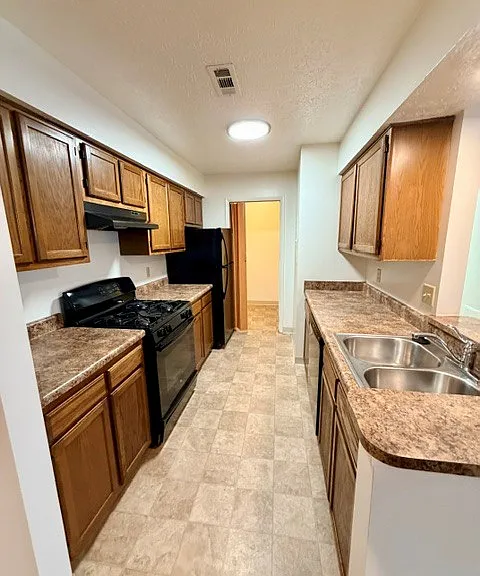 Laundry area straight ahead- fits a full-size washer/dryer