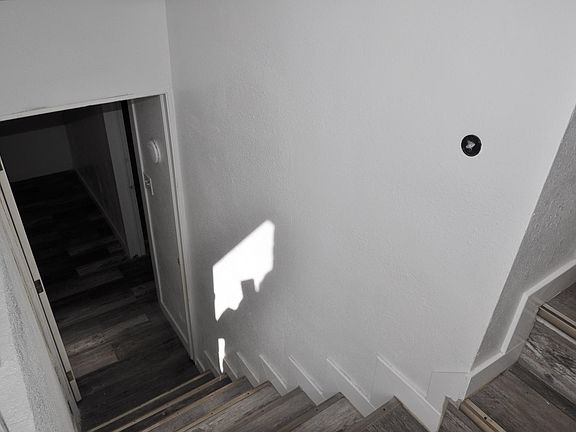 Stairs to basement with separate backdoor entrance.