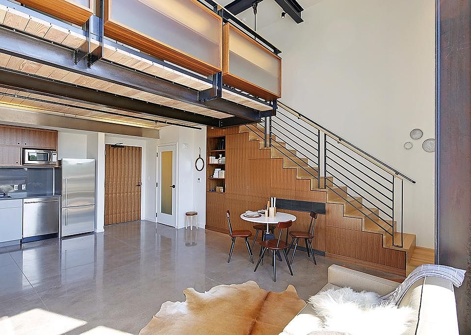 Polished concrete and steel I-beams compliment the real wood accents throughout, providing a throughly modern/industrial feel.