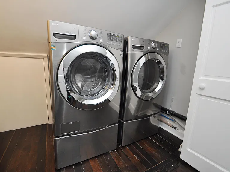 private, In-unit LG Stainless Steel front-load washer and dryer set on pedestals for convenient and free-to-use laundry