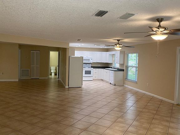 Open living area looking into kitchen
