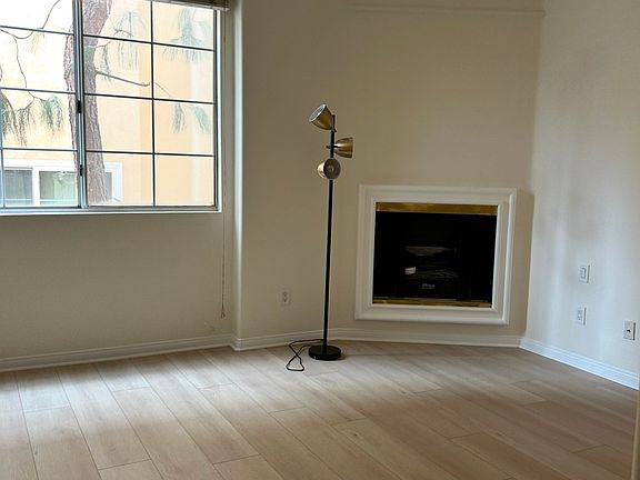 Spacious primary bedroom with fireplace