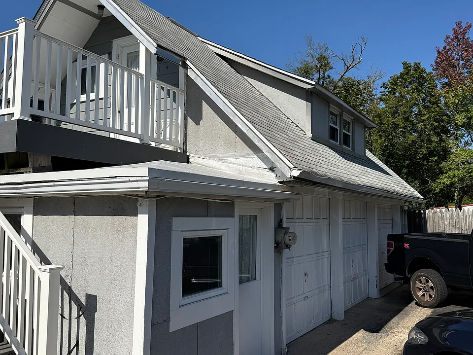 Apartment Access to Second Floor.
Laundry Below, Garage & Parking