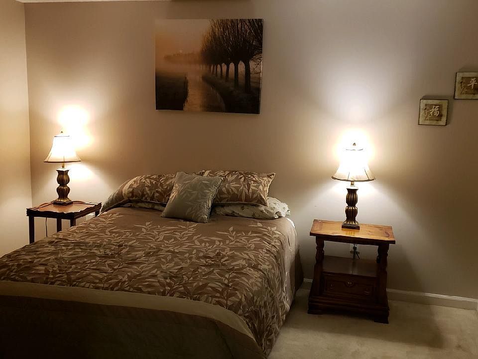 Master bedroom has a door onto the sun room and a double closet, cable line and box for TV .