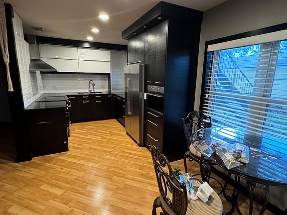 View from the front door into open plan kitchen and breakfast nook