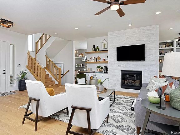 Great room with stone fireplace and built-in cabinets