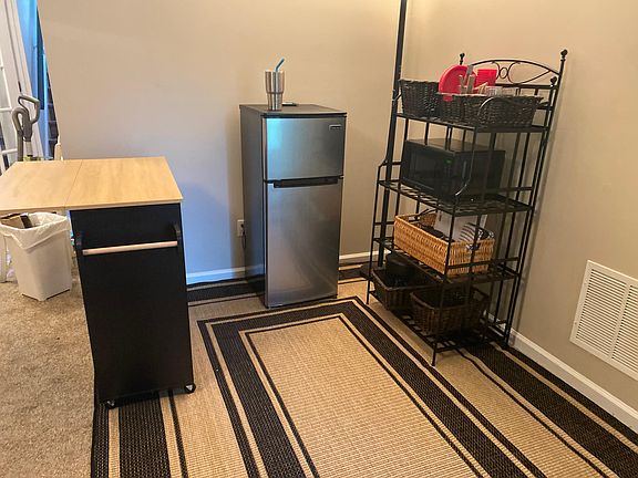 Kitchenette - microwave, hot plate, refrigerator, basic pots and pans and moveable kitchen island.