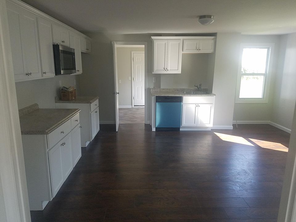 New kitchen with stainless steel appliances.