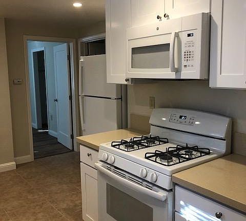 Gas stove with microwave