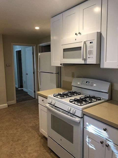 Gas stove with microwave