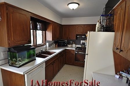 Kitchen: Hand stained wood cabinets