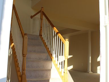 Staircase w/ Front Den and Dining Room to Right