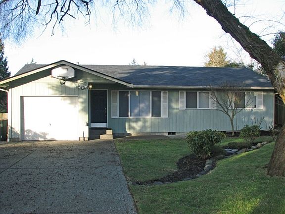 Nicely landscaped front yard, fully fenced for privacy. Long, paved driveway provides good parking space for several vehicles or RV. Adding a gate would be easy!