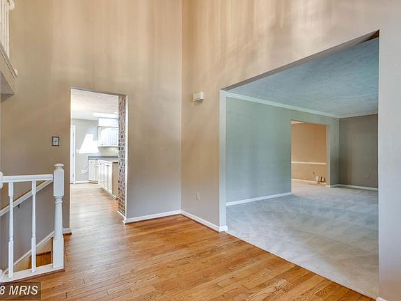 Entryway looking into living and kitchen