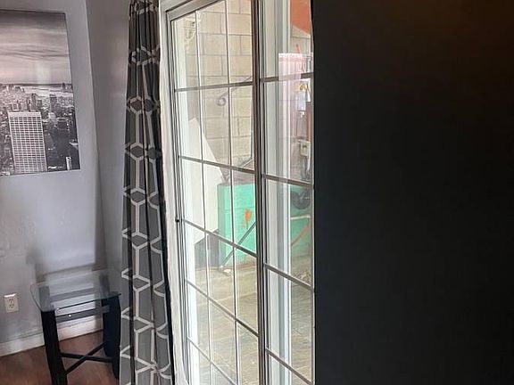 Bedroom door that leads to the small patio.