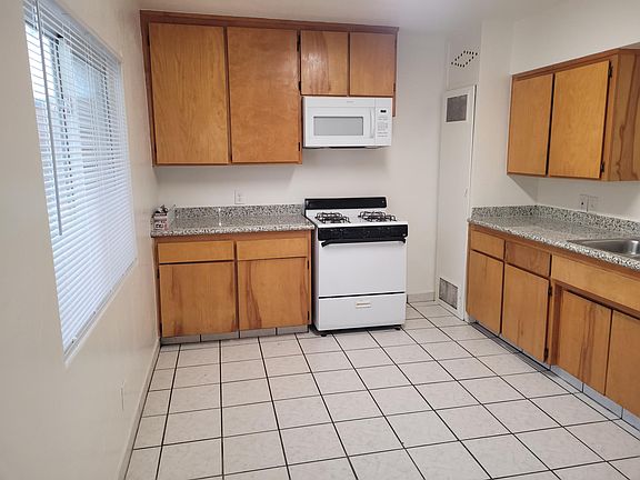 Kitchen with space for small dining table.