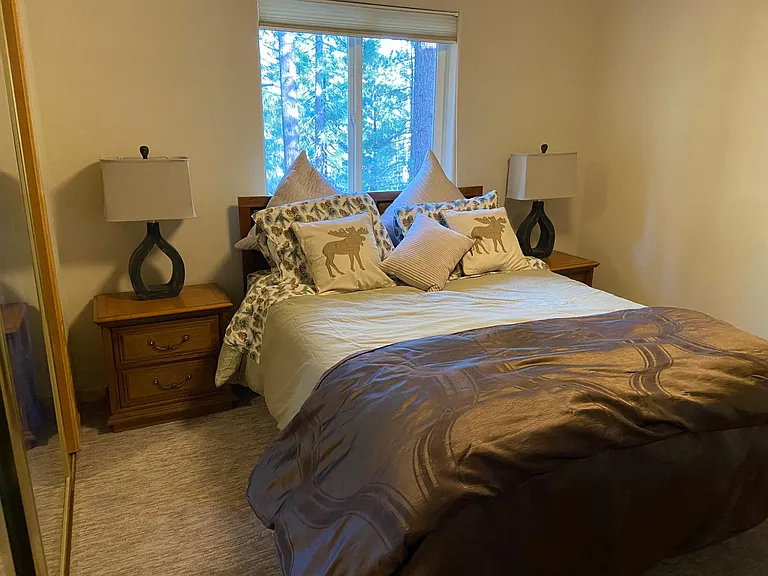 Second bedroom upstairs is a Queen bed and wall to wall closet behind the mirror doors on the left