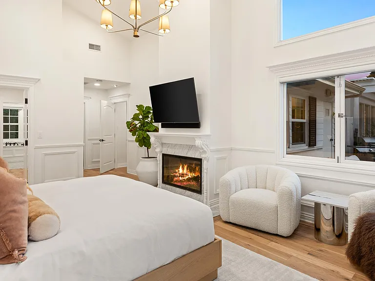 Ensure tranquil privacy with blackout shades and a cozy fireplace in Bedroom 1, offering a private and serene escape.