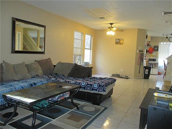 Another view of living & dining room.  All tile downstairs.