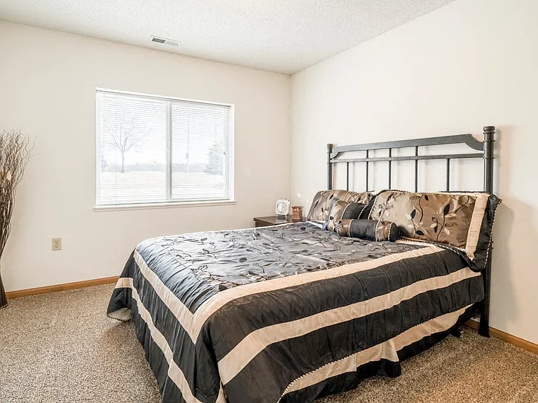 Large bedroom windows let in lots of natural light.